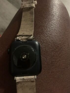 Apple Watch with Black Case and Cream Strap